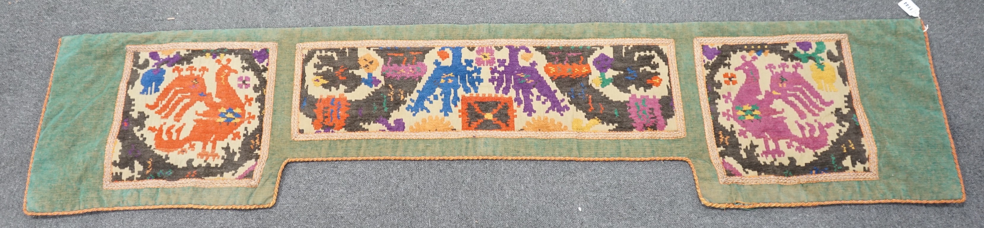 A 1920's English needlework pelmet, 205cm wide